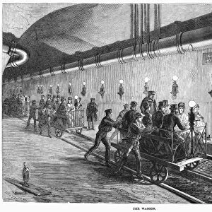 PARIS: SEWERS, 1869. Visitors to the new sewer system in Paris, France, are transported in waggons on tracks. Wood engraving, English, 1869