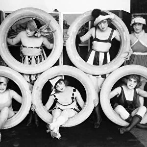 PERFORMERS, c1925. Mack Sennett girls posed with tires. Photograph, c1925