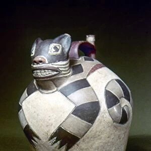 PERU: NAZCA WHISTLING JAR. Ceramic whistling water jar with a sculpted cat on the top, made by the Nazca civilization of ancient Peru, 1st to 8th century A. D