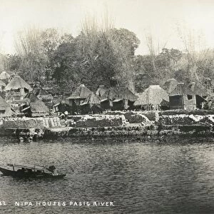 PHILIPPINES, c1900. A view of nipa houses along the Pasig River in Manila, the Philippines