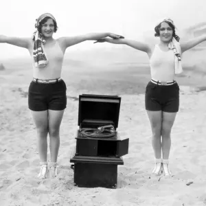 PHONOGRAPH, c1929. Joan Crawford and Dorothy Sebastian photographed c1929 with a portable phonograph in Santa Monica, California PHONOGRAPH, c1929. Joan Crawford and Dorothy Sebastian photographed c1929 with a portable phonograph in Santa Monica, California