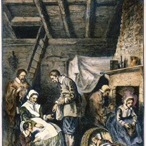 PILGRIMS STARVING. Dealing out the daily five kernels of corn per person during the starving time in the Plymouth Colony of Massachusetts, Spring 1623. Wood engraving, 19th century