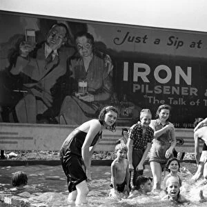 PITTSBURGH: CHILDREN, 1938. Steelworkers children swimming in a homemade pool