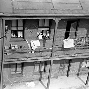 PITTSBURGH SLUM, 1938. Housing in the slum section of Pittsburgh, Pennsylvania