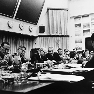 President Lyndon B. Johnson (fourth from left) and other U. S. officials conferring with South Vietnamese leaders Nguyen Van Thieu and Nguyen Cao Ky (both across from Johnson, Thieu leaning forward in foreground) over the progress of the Vietnam War, at Honolulu, Hawaii, 7 February 1966