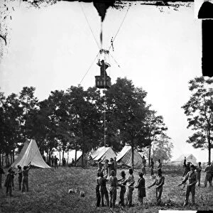 Professor Thaddeus Sobieski Coulincourt Lowe behind Union lines observing the Battle of Fair Oaks, Virginia, from his balloon Intrepid, 31 May 1862
