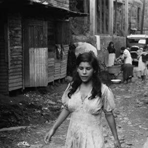 PUERTO RICO: SLUM, 1942. A street in the slum area of the hill town of Lares, Puerto Rico. Photograph by Jack Delano, January 1942