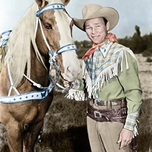 ROY ROGERS (1911-1998). Ne Leonard Slye. American singing cowboy actor. With his horse, Trigger