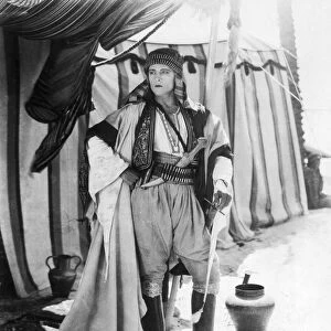 RUDOLPH VALENTINO (1895-1926). American (Italian-born) film actor. In a scene from the film The Sheik, 1921