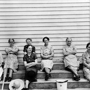RURAL CHURCH, 1939. Women of the congregation of Wheeleys Church seated on the steps with brooms