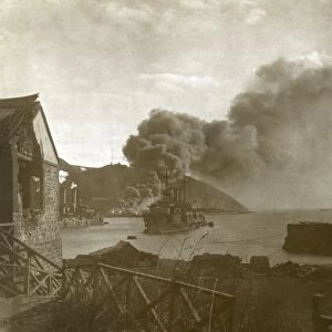 RUSSO-JAPANESE WAR, 1905. Russian warships in the harbor with smoke from a fire