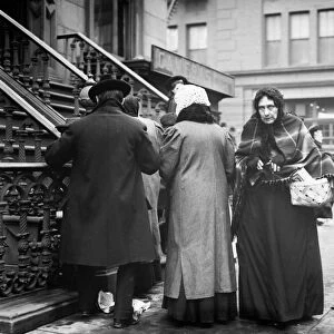 SALVATION ARMY, 1908. Taking home baskets for Christmas dinner from the Salvation Army