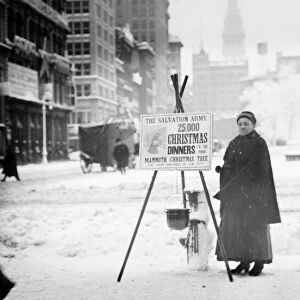 SALVATION ARMY, c1910. Salvation Army volunteer collecting funds for Christmas