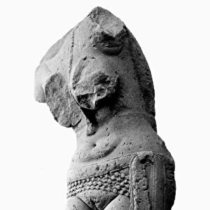 Sandstone sculpture fragment of a Yakshini, a benevolent tree spirit in Sanskrit mythology, who looks after treasure hidden in the earth. From Sanchi, India, 1st century B. C