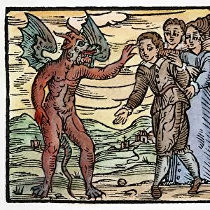 SATAN & SORCERER, 1626. Satan applying his claw mark to an apprentice sorcerer. Color woodcut