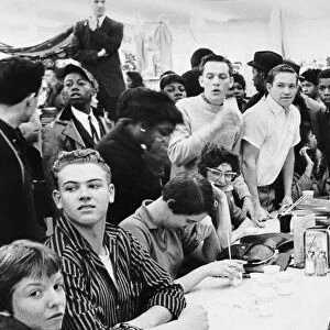 Scene at a department store lunch counter in Portsmouth, Virginia, 16 February 1960, minutes before fighting erupted between white high school students and black youths seeking service