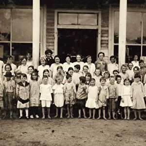 SCHOOL CHILDREN, 1914. A group of children attending a mill school at Barker Cotton
