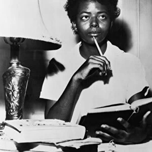 SCHOOL DESEGREGATION, 1957. African American student Elizabeth Eckford studying