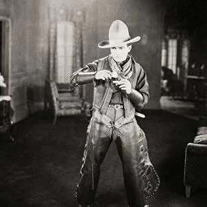 SILENT FILM STILL: COWBOYS. American actor Richard Barthelmess (1895-1963) portraying a cowboy in a silent film, c1926