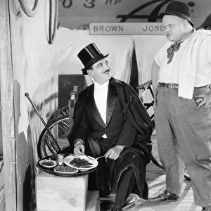 SILENT FILM STILL: EATING. Raymond Griffith and Charles H. Puffy