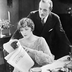 SILENT FILM STILL: READING. Anna Q. Nilsson and Lewis Stone in The Talker, 1925
