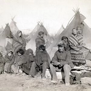 SIOUX ENCAMPMENT, 1891. Group of Minionjou Sioux Native Americans in a tipi camp, probably on or near the Pine Ridge Reservation in South Dakota. Photographed in 1891 by John C. H. Grabill