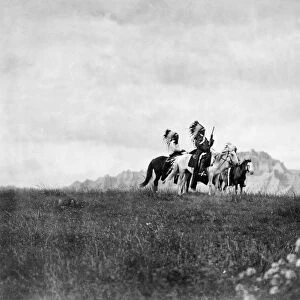 SIOUX HORSEMEN, c1905. A group of three Sioux Native American men on horseback