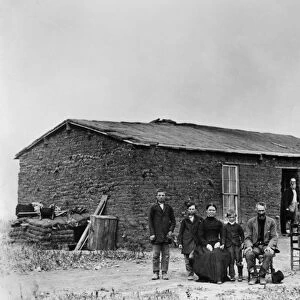 SOD HOUSE, c1880. A homesteader family in front of their sod house. Photograph, c1880