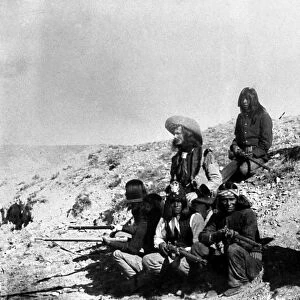 SOLDIERS AND SCOUTS. Soldiers with Apache scouts in the American southwest. Photograph, late 19th century
