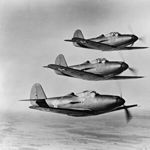 A squadron of Bell P-39 Airacobra fighter planes of the Army Air Corps flying in formation during World War II