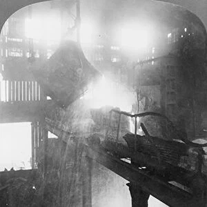STEEL FACTORY, c1907. Emptying a 20 ton ladle of molten iron at the steel works in Homestead