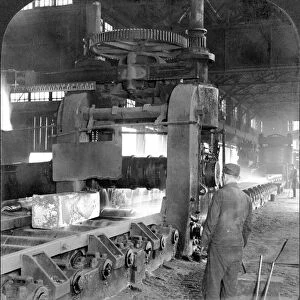STEEL FACTORY, c1907. A white-hot ingot of steel on a conveyor belt in a steel mill in Homestead