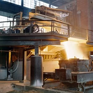 STEEL FOUNDRY, c1941. Steel pouring into a mold from an electric furnace at the