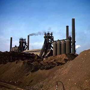 STEEL MILL, 1941. Blast furnace and iron ore at the Carnegie-Illinois Steel Corporation