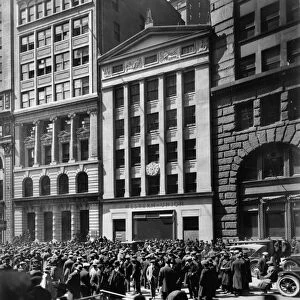 STOCK BROKERS, c1921. Crowd of men involved in curb exchange trading in front of