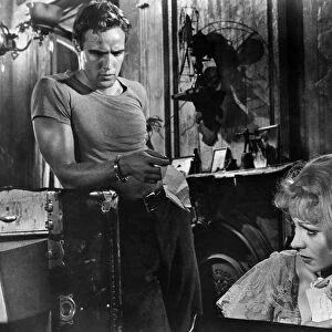 A STREETCAR NAMED DESIRE. Marlon Brando as Stanley Kowalski and Vivien Leigh as his sister-in-law Blanche DuBois in the film adaptation of Tennessee Williams play, directed by Elia Kazan, 1951