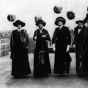 SUFFRAGETTES, 1912. Suffragettes holding lanterns on a rooftop in New York City