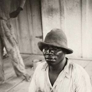 SUGAR MILL WORKER, 1934. African American sugar mill worker at at Alma Plantation