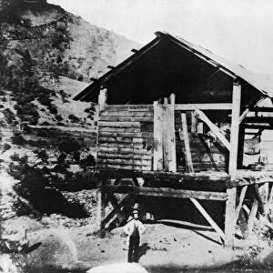 SUTTERs MILL, c1850. James Marshall, prospector, standing in front of Sutters Mill