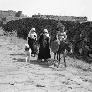 SYRIA: DRUZE CHILDREN, 1938. Druze children on a Roman street in Shahba, Syria