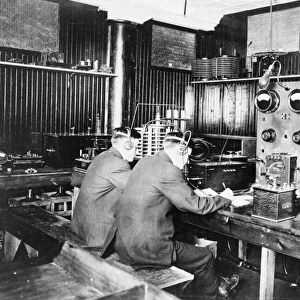 TELEGRAPH OPERATORS, c1912. Telegraph operators copying messages transmitted from ships at sea