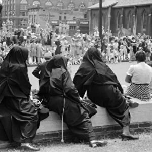 TENNESSEE: PARADE, 1940. Nuns watching the parade at the Cotton Carnival in Memphis, Tennessee