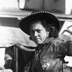 TEXAS: COWGIRL, 1940. Female rodeo performer at San Angelo Fat Stock Show, San Angelo, Texas. Photograph by Russell Lee, March 1940