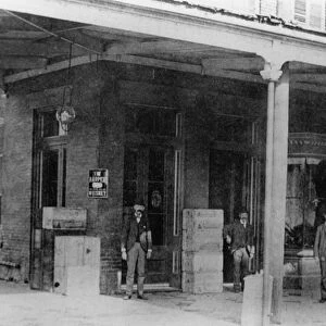 TEXAS: GALVESTON, c1900. Men standing in front of the Edmond Dufau Wholesale Liquor