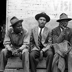 TEXAS: YOUNG MEN, 1939. Four young African American men seated on a bench, Waco Texas