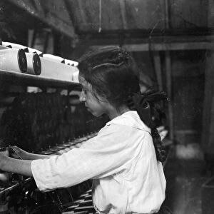 TEXTILE MILL, 1916. Young spooler tender at the American Linen Company factory