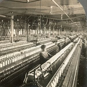 TEXTILE MILL, c1915. Spinning cotton in a textile mill, Lawrence, Massachusetts