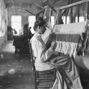 TEXTILE WORKER, c1910. A New England textile worker. Photographed c1910 by Lewis Hine