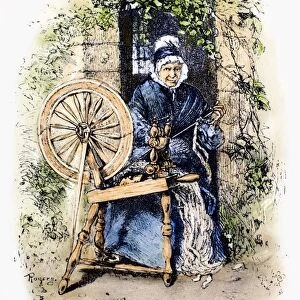 TEXTILES: SPINNING WHEEL. An 18th century American spinning wheel. Wood engraving, 19th century