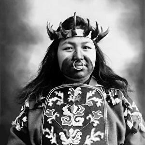 TLINGIT NATIVE AMERICAN, c1906. Kaw-Claa, a Tlingit Native American woman, in full potlatch dancing costume. Photograph, c1906
